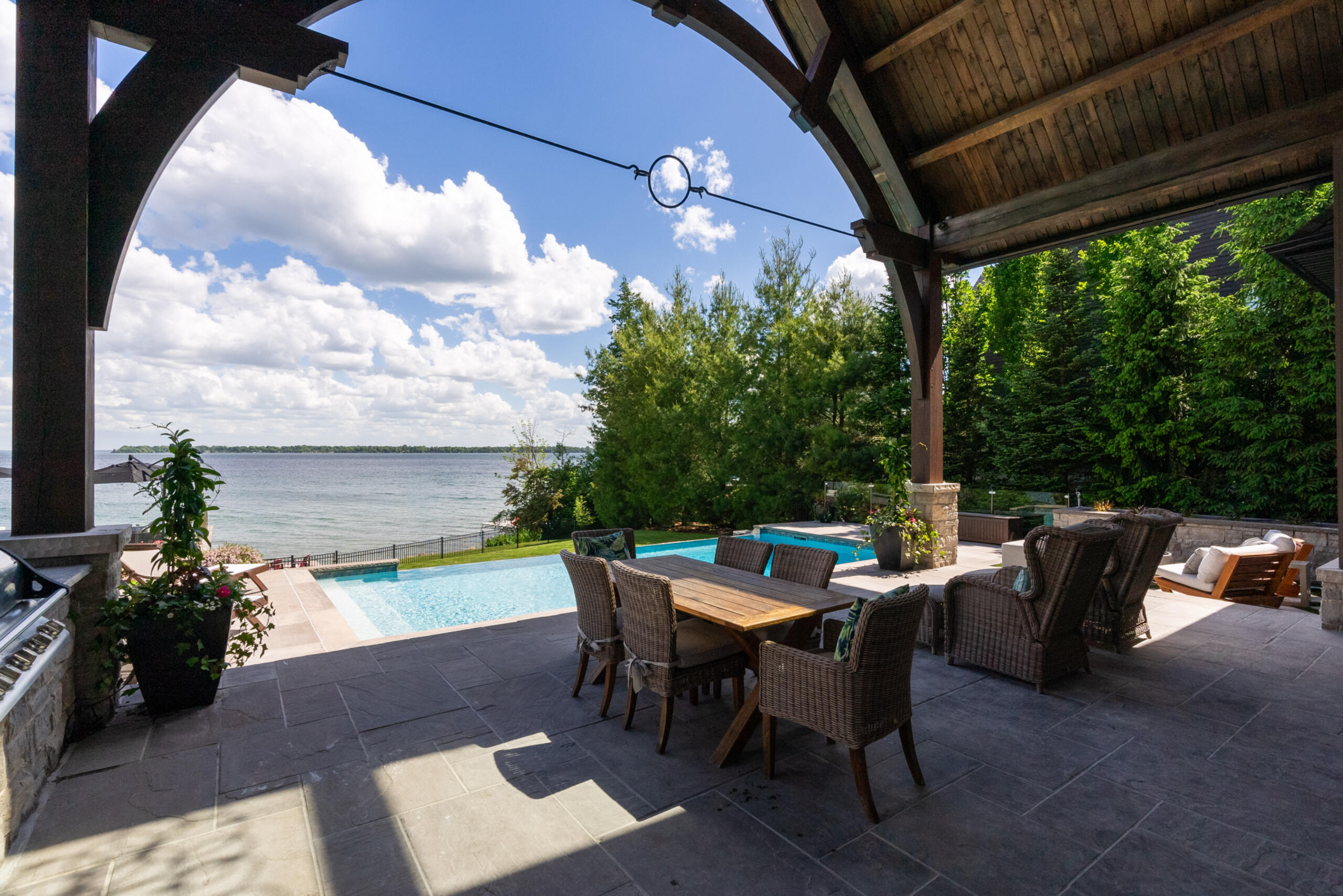 Cover patio area looking out at pool and lake Cover patio area looking out at pool and lake