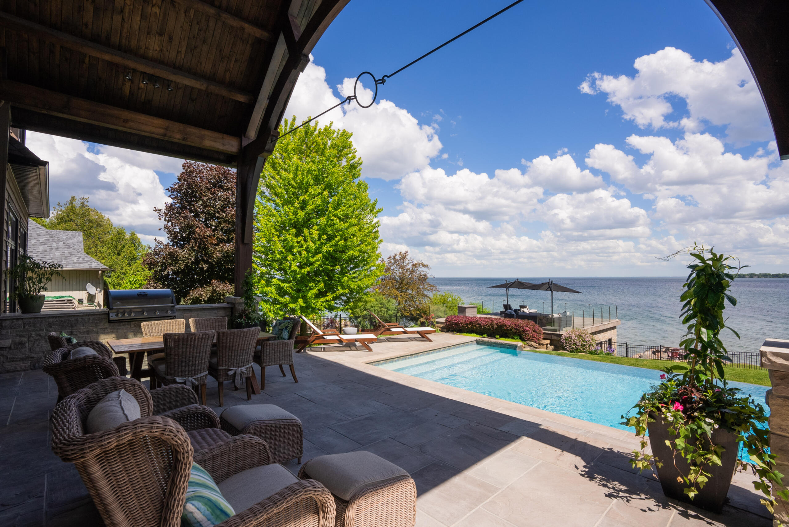 Patio looking onto the pool and lake Patio looking onto the pool and lake